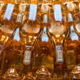 Rose bottles stacked on top of one another