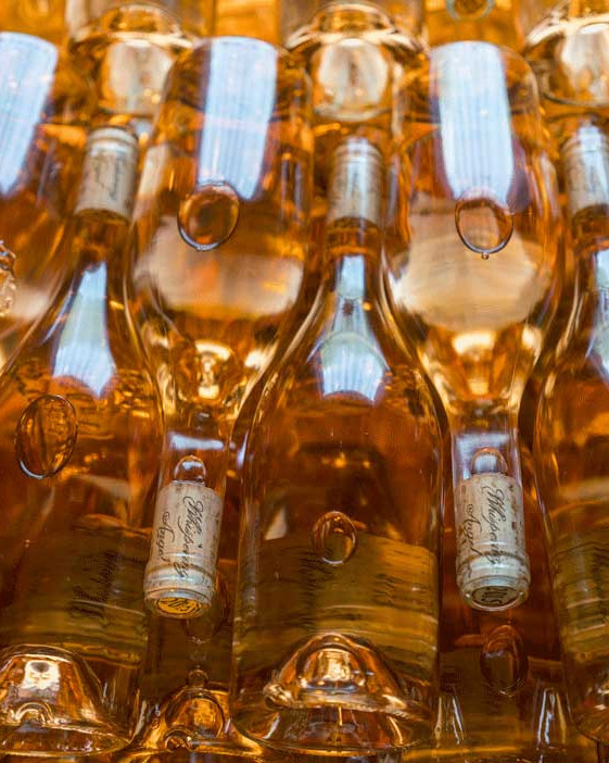 Rose bottles stacked on top of one another