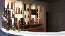 Bottles lined up on shelves