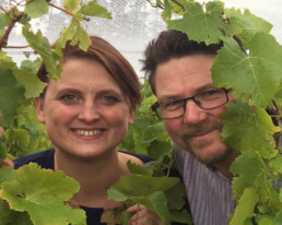 Lucie and Brook pose in the vineyard