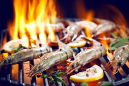 Prawns cooking on barbecue