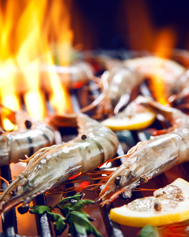 Prawns cooking on barbecue