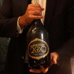 Man holding magnum bottle of Champagne