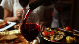 Stock image of wine being poured