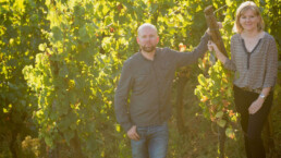 Veronique and Thomas Muré standing in the vineyard